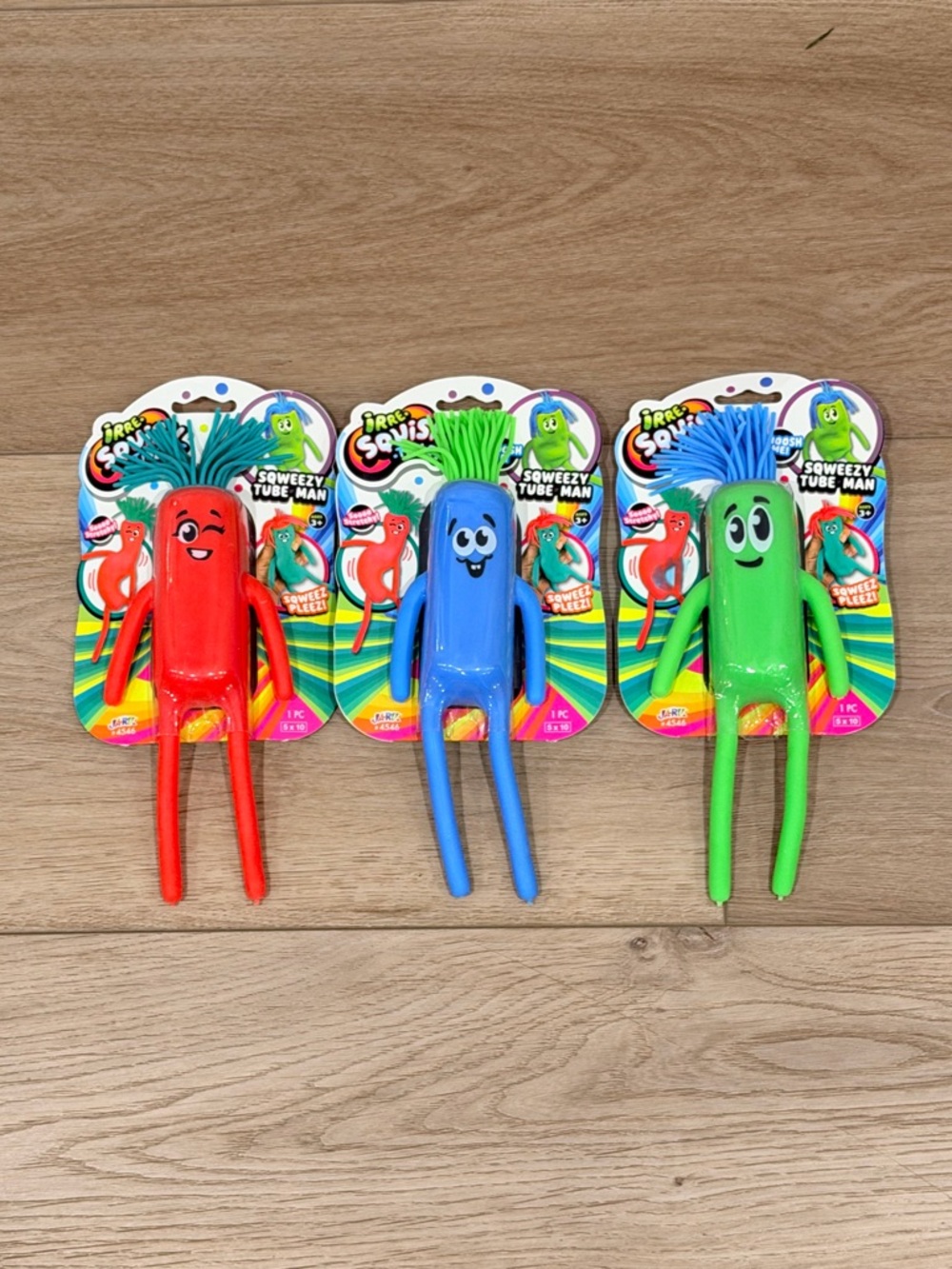 Squeezy Tube Man Kids Plush-Like Toys in Red, Blue & Green